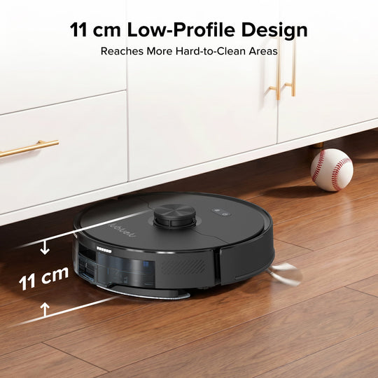 Robotic vacuum cleaner with 11 cm low-profile design cleaning under a cabinet.