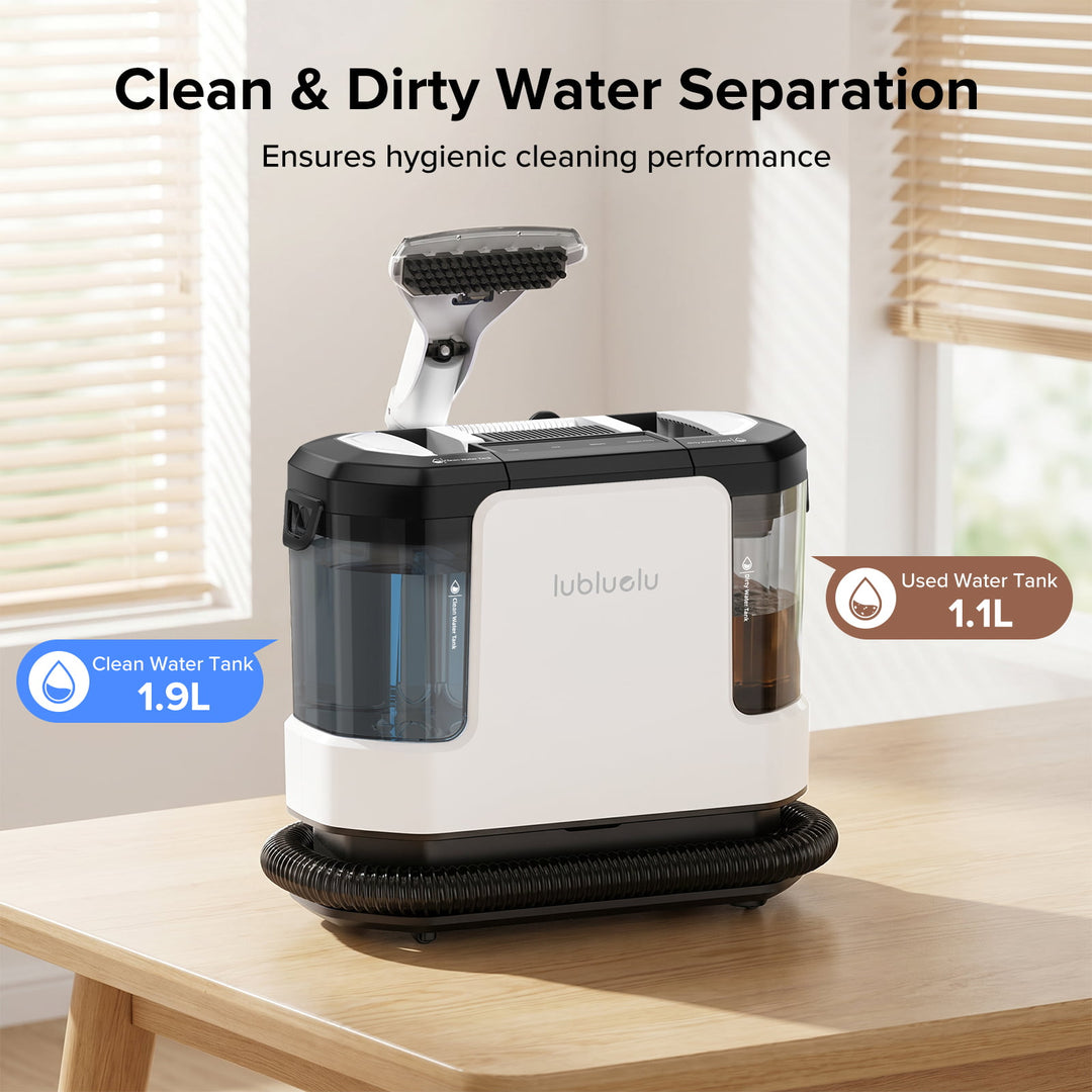 A desktop water separator and cleaner device by lubluelu sits on a light wood table in a bright room with window blinds. The product has a white body with black top and base components, and transparent tanks.
