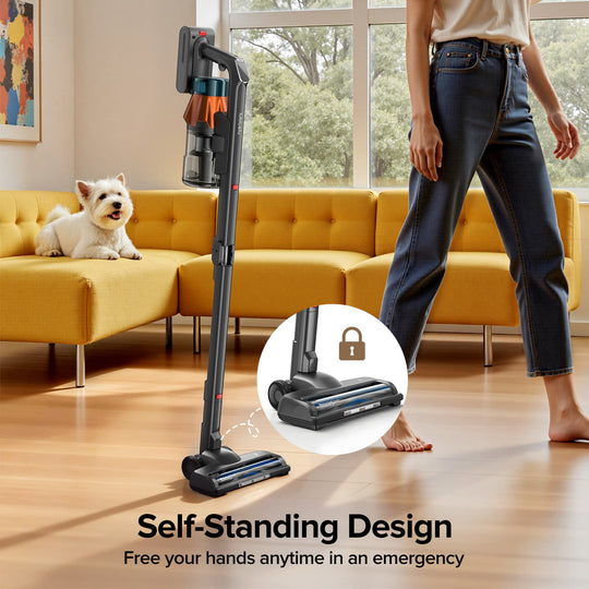 Person using a self-standing vacuum cleaner in a living room with a dog and yellow sofa.